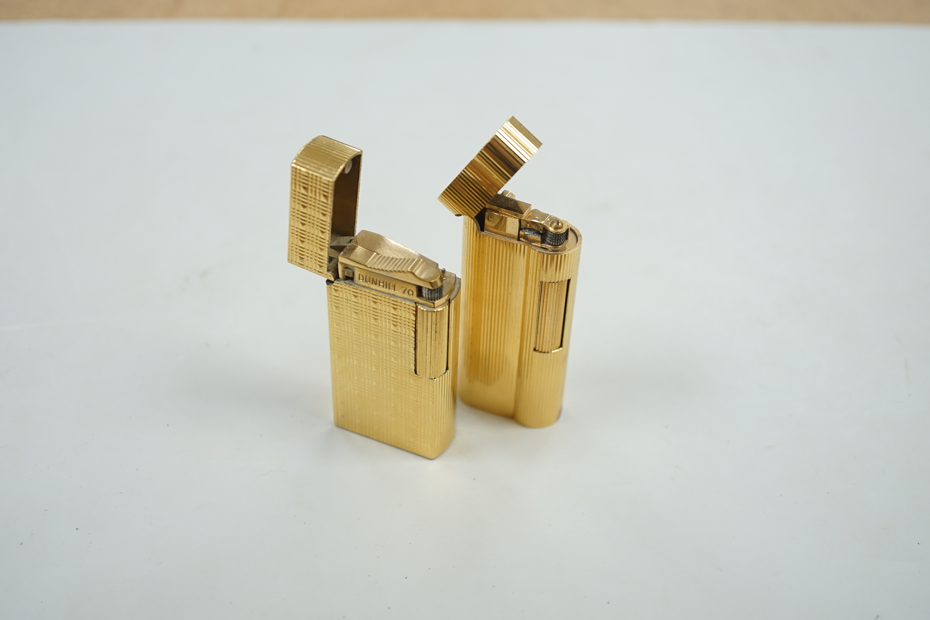 Two Dunhill lighters.